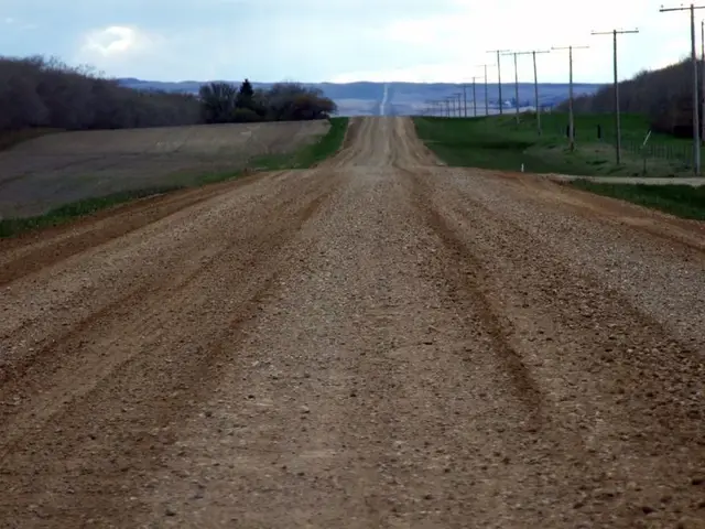 Gravel road stretching across the prairie